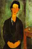 Portrait of Chaim Soutine Seated at a Table.